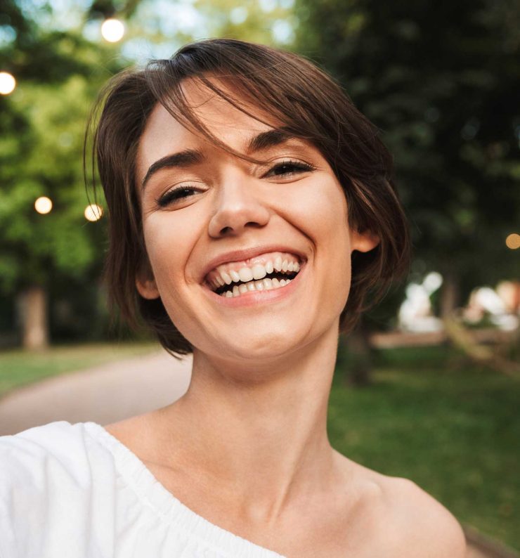 smiling-young-girl-taking-a-selfie-NR2ZWMP-1.jpg